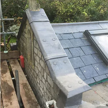 Lead roof covering and adjoining stonework